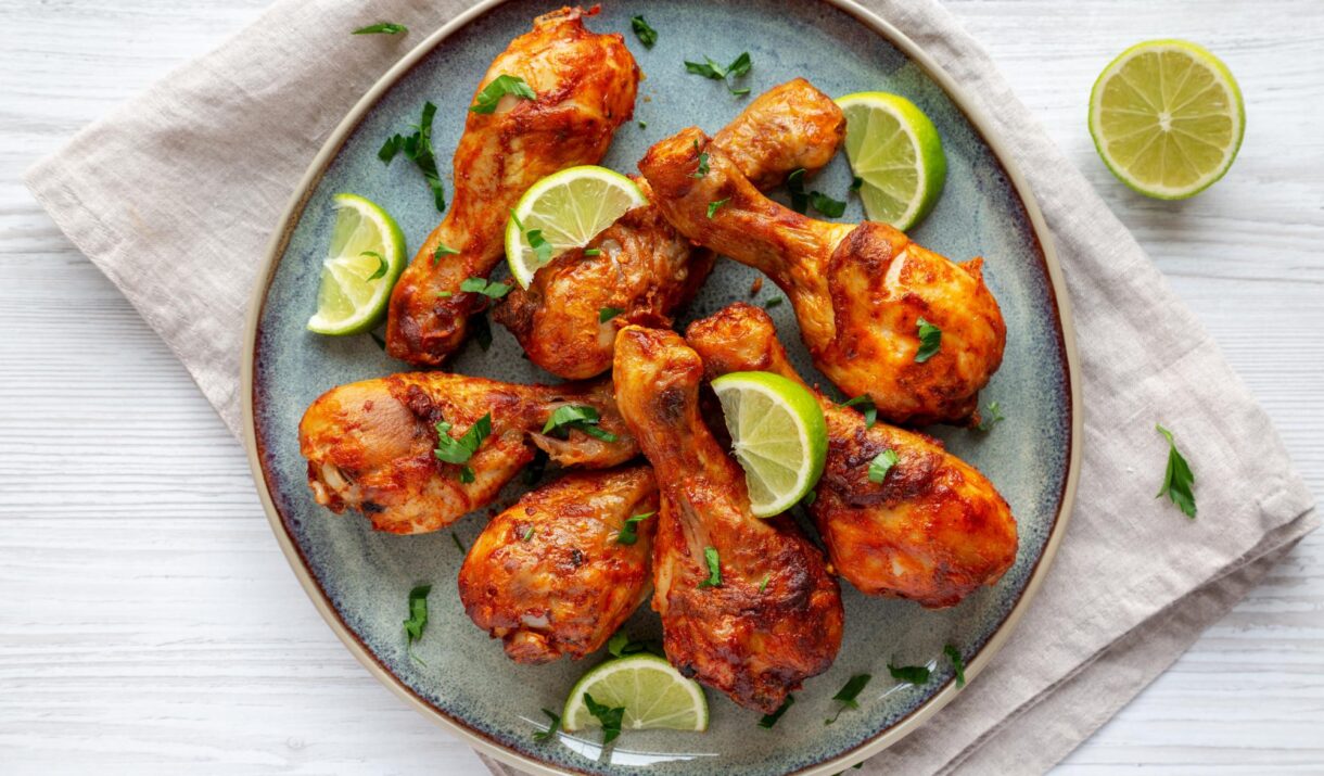 homemade grilled jerk chicken with lime on a plate 2024 07 19 21 42 09 utc